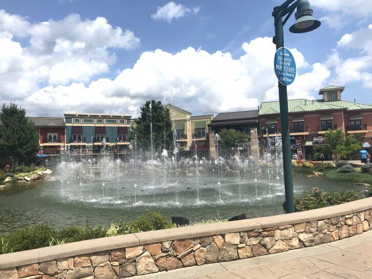 the island fountain show during the day pigeon forge