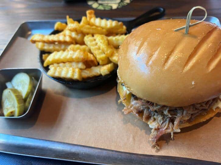 pulled pork sandwich at oak and star tavern at epic universe